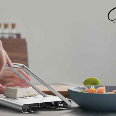 Man,Cutting,Feta,Cheese,On,Olive,Wood,Board,For,Greek Man,Cutting,Feta,Cheese,On,Olive,Wood,Board,For,Greek